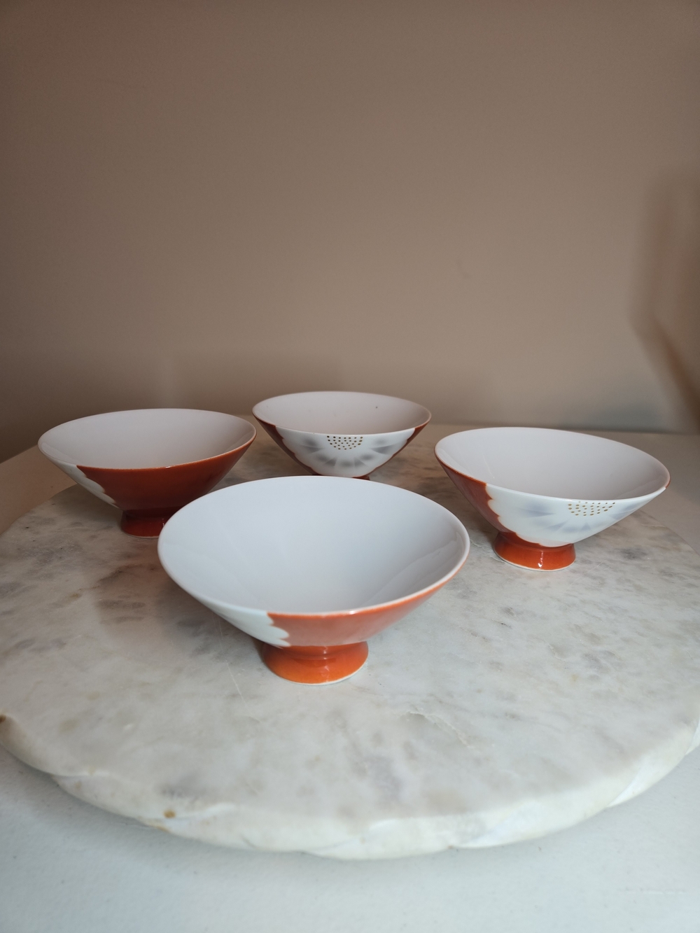 Set of Four White and Orange Footed Porcelain Rice Bowls